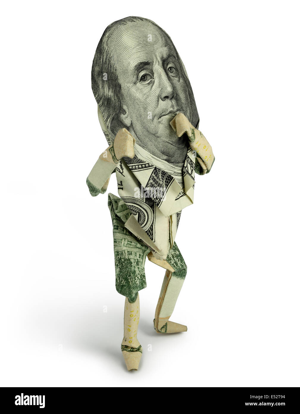 Origami figura umana pone con i pugni fino alla pura sfondo bianco, dotato di Ben Franklin's volto da 100 dollari. Foto Stock