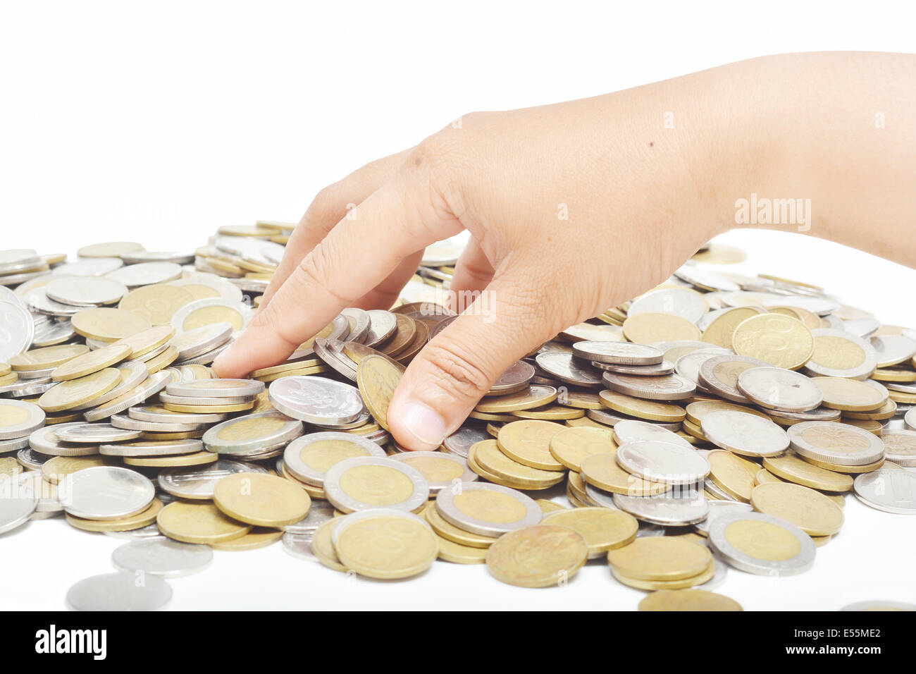 I movimenti della mano tenendo le monete dalla pila. Foto Stock
