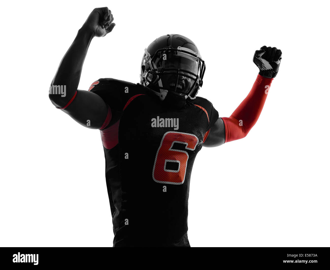 Un giocatore di football americano a braccia alzate ritratto in silhouette ombra su sfondo bianco Foto Stock