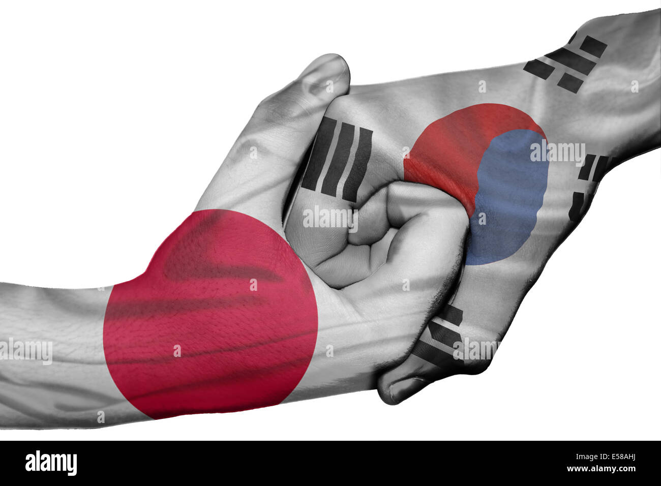 Handshake diplomatiche tra paesi: bandiere di Giappone e Corea del Sud sovradipinta le due mani Foto Stock