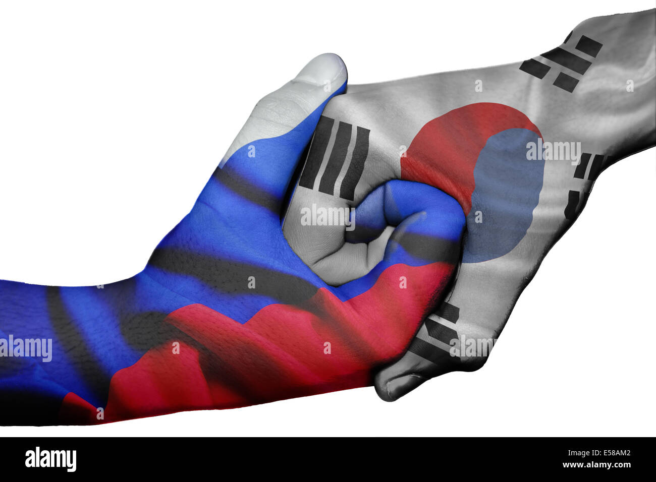 Handshake diplomatiche tra paesi: bandiere della Russia e Corea del Sud sovradipinta le due mani Foto Stock