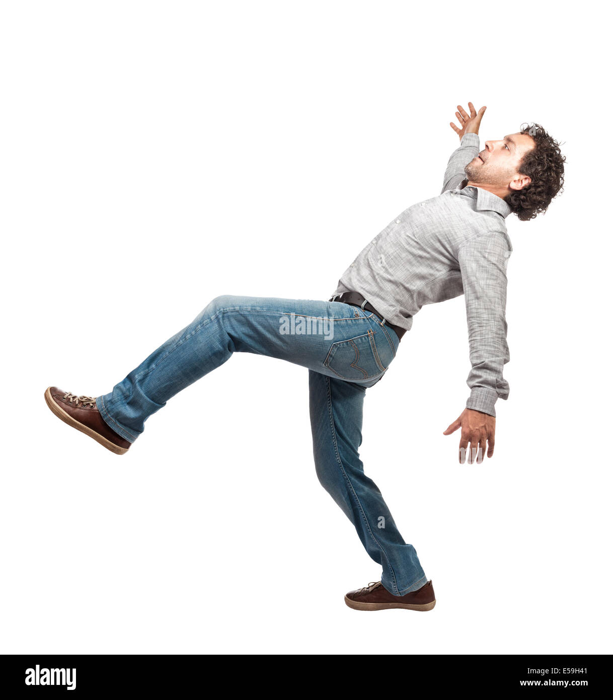 L'uomo cerca di equilibrio stesso isolato su bianco Foto Stock