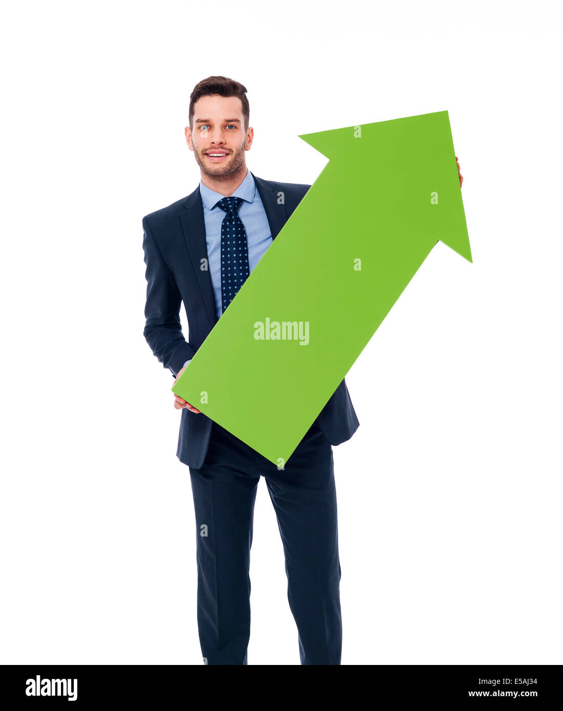 Happy businessman con una freccia verde, Debica, Polonia Foto Stock