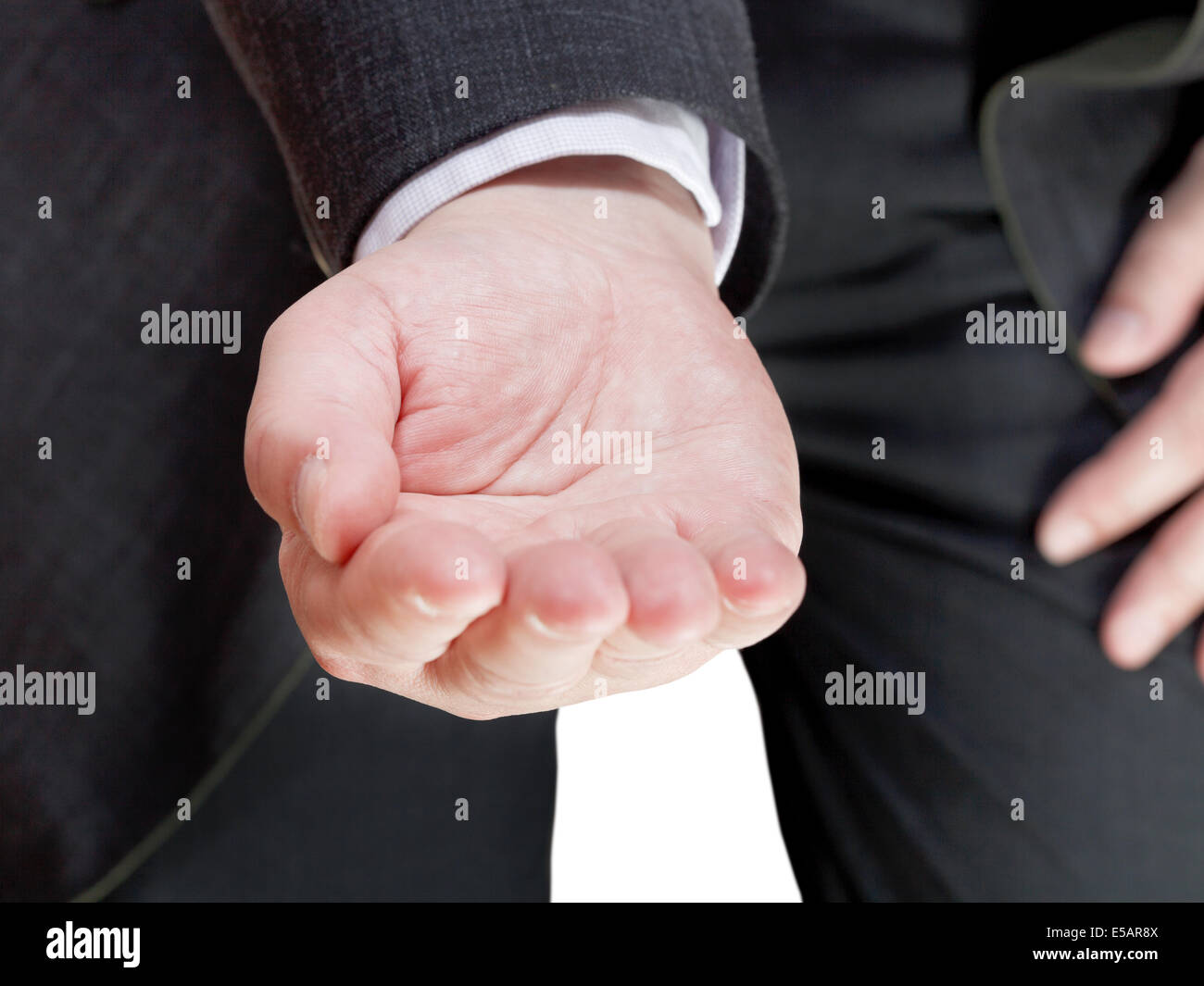 Imprenditore detiene il pugno - mano gesto isolato su sfondo bianco Foto Stock