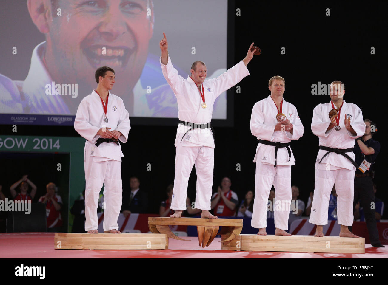 SECC, Glasgow, Scozia, Regno Unito, sabato, 26 luglio 2014. Vincitori delle Medaglie nel Concorso JUDO maschile +100kg sul podio ai Glasgow 2014 Commonwealth Games. Da sinistra a destra. Ruan Snyman, Sudafrica, Silver, Christopher Sherrington, Scozia, Gold, Mark Shaw, Galles, Bronze, Jake Andrewartha, Australia, Bronzo Foto Stock