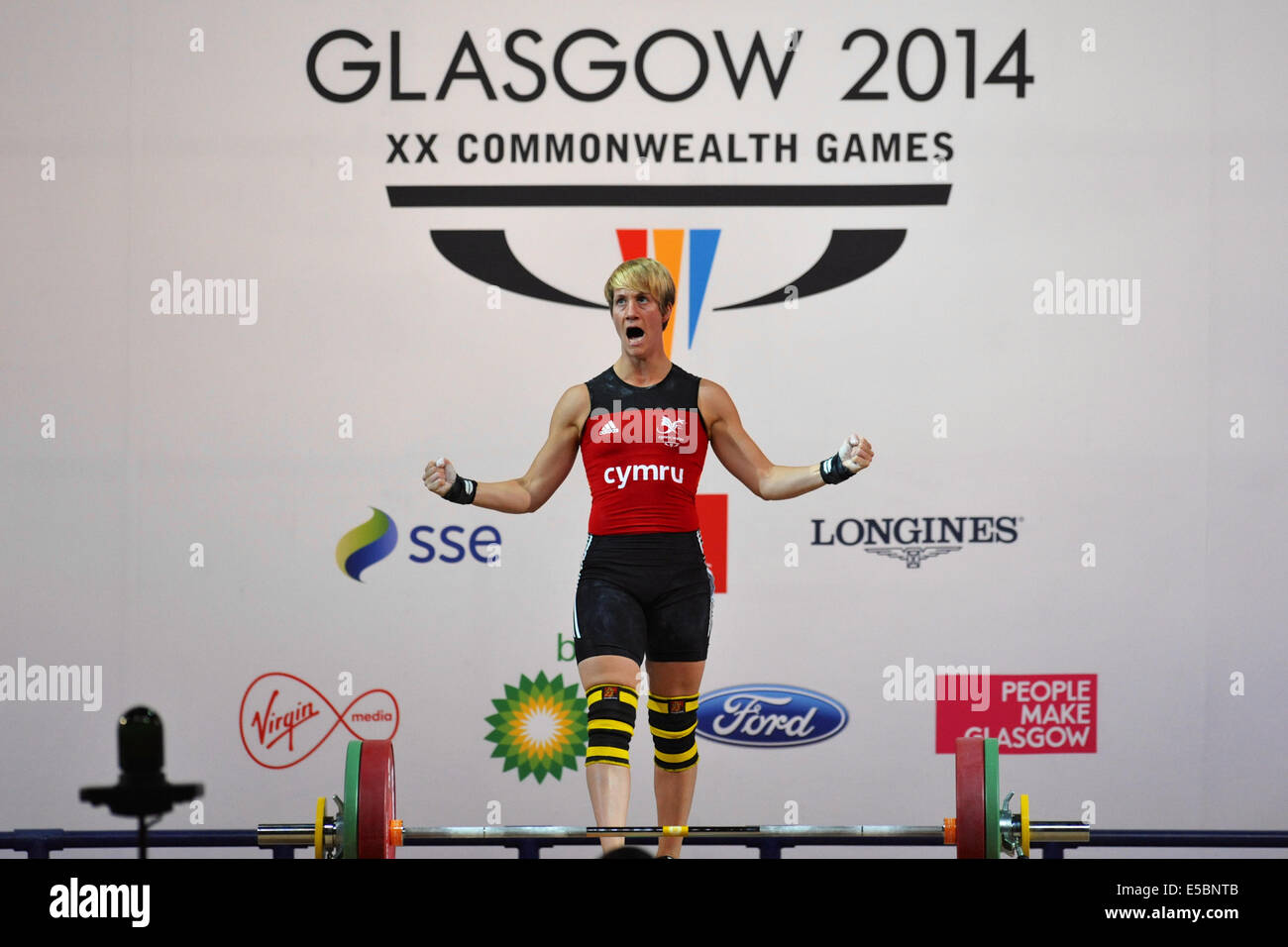 Glasgow, Regno Unito. 26 Luglio, 2014. Michaela Breeze (WAL) gridando dopo la produzione di un buon sollevare durante la donna 58kg pesi concorrenza a i Giochi del Commonwealth a Glasgow. Il Breeze ha vinto il bronzo della concorrenza con un sollevamento totale di 202kg. Credito: Michael Preston/Alamy Live News Foto Stock
