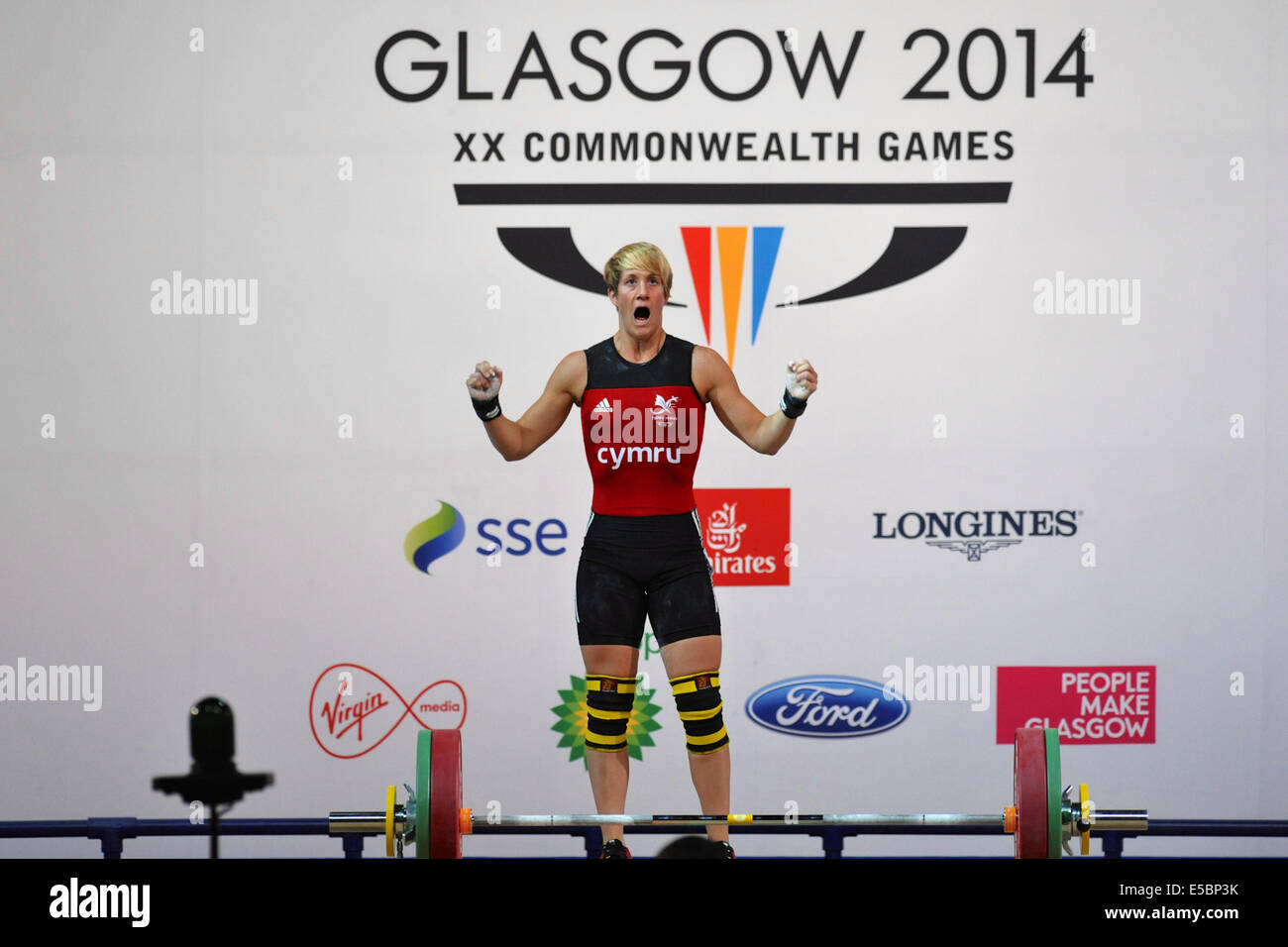 Glasgow, Regno Unito. 26 Luglio, 2014. Michaela Breeze (WAL) gridando dopo la produzione di un buon sollevare durante la donna 58kg pesi concorrenza a i Giochi del Commonwealth a Glasgow. Il Breeze ha vinto il bronzo della concorrenza con un sollevamento totale di 202kg. Credito: Michael Preston/Alamy Live News Foto Stock