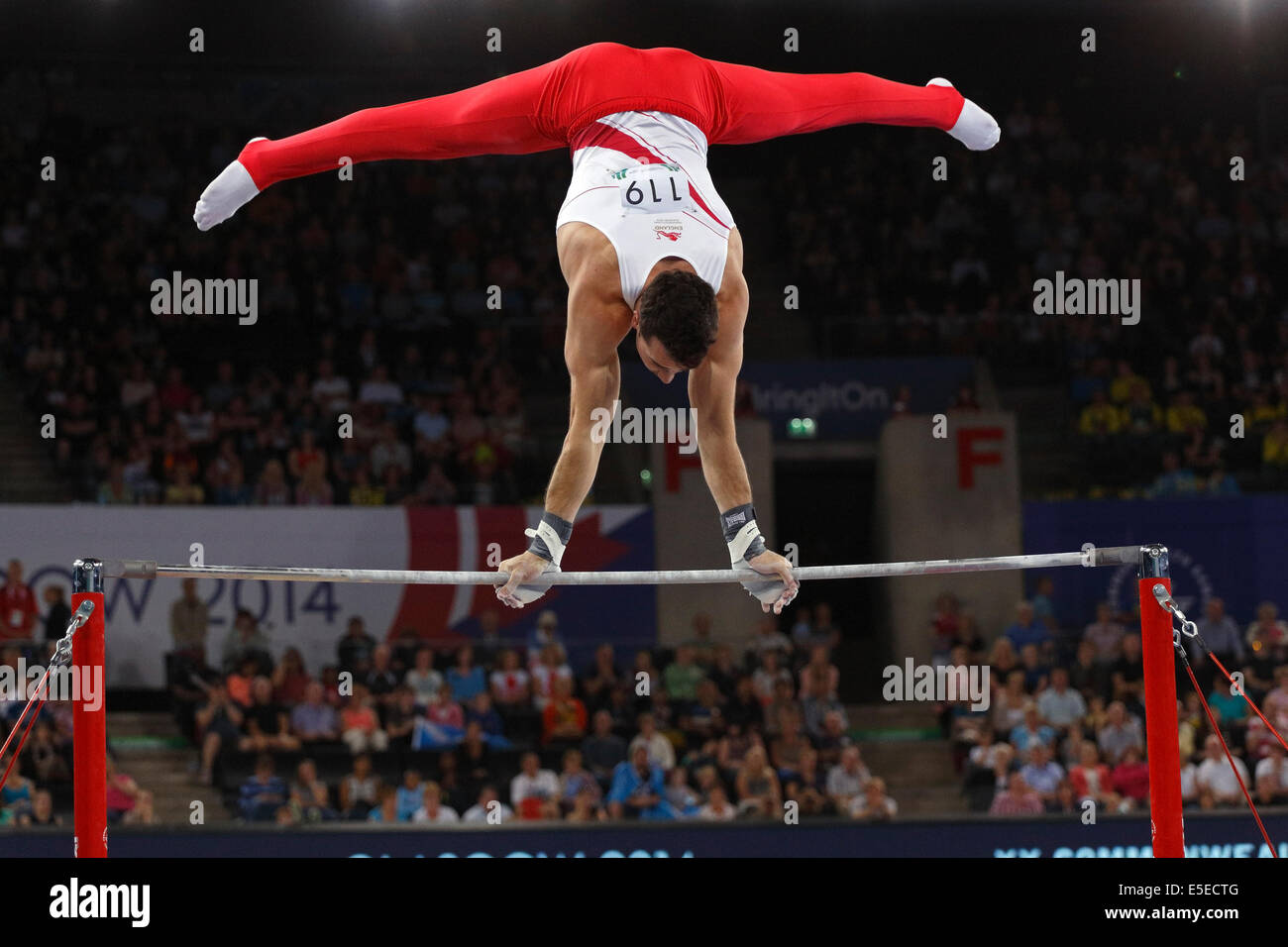 SSE Hydro, Glasgow, Scozia, Regno Unito, martedì, 29 luglio 2014. Kristian Thomas inglese al bar orizzontale durante il Concorso della squadra di ginnastica artistica ai Giochi del Commonwealth di Glasgow 2014 Foto Stock