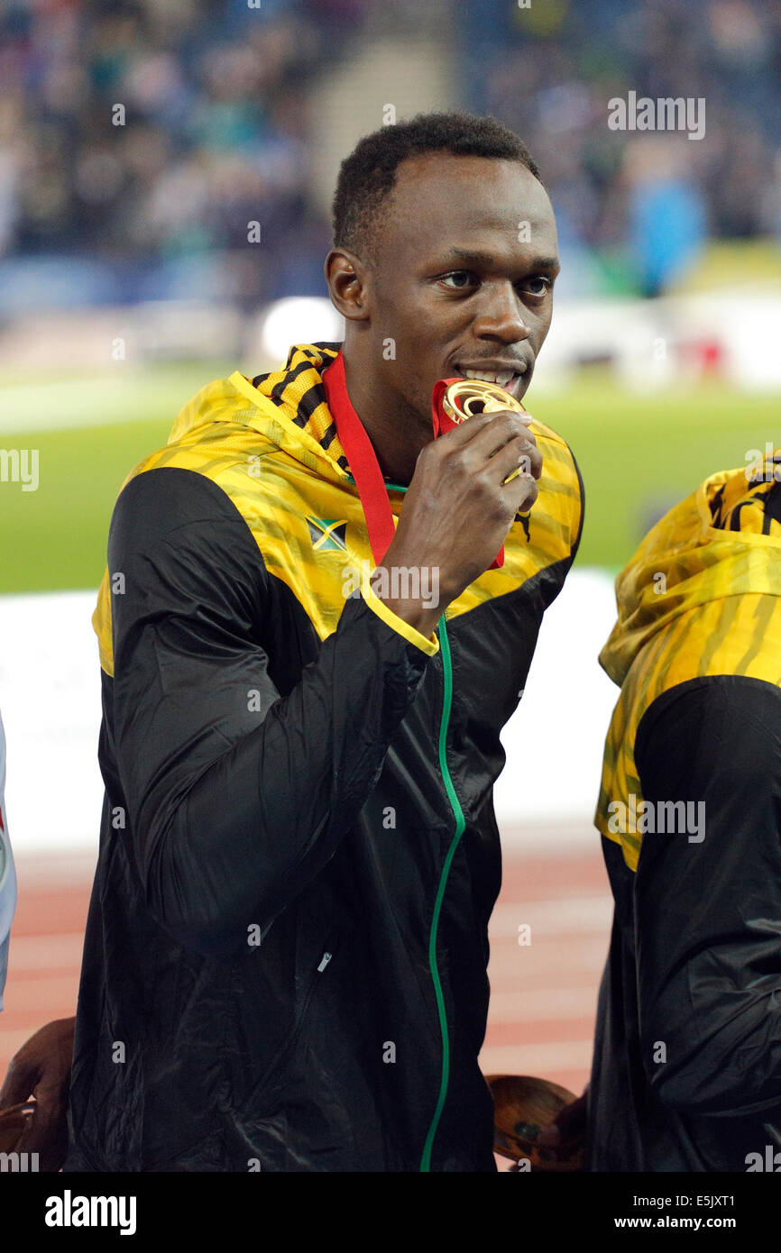 Hampden Park, Glasgow, Scozia, Regno Unito, sabato, 2 agosto 2014. Glasgow 2014 Commonwealth Games, relè 4 x 100 m da uomo, cerimonia di Medaglia. Usain Bolt, Giamaica, Oro Foto Stock
