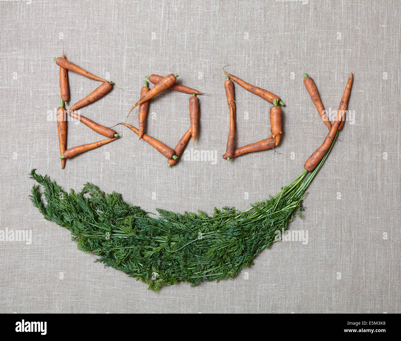 'Corpo' fuori di farro con carote organico Foto Stock