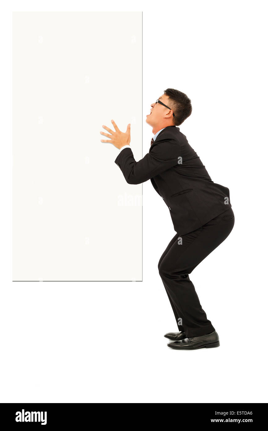 Funny giovane uomo d affari di contenimento della scheda bianca Foto Stock