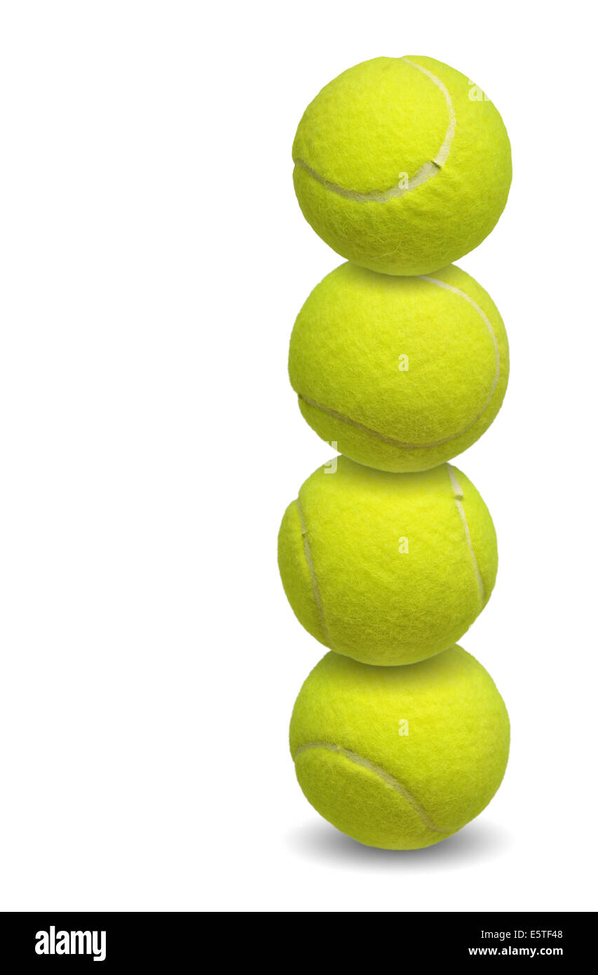 Palle da tennis impilati insieme su bianco Foto Stock