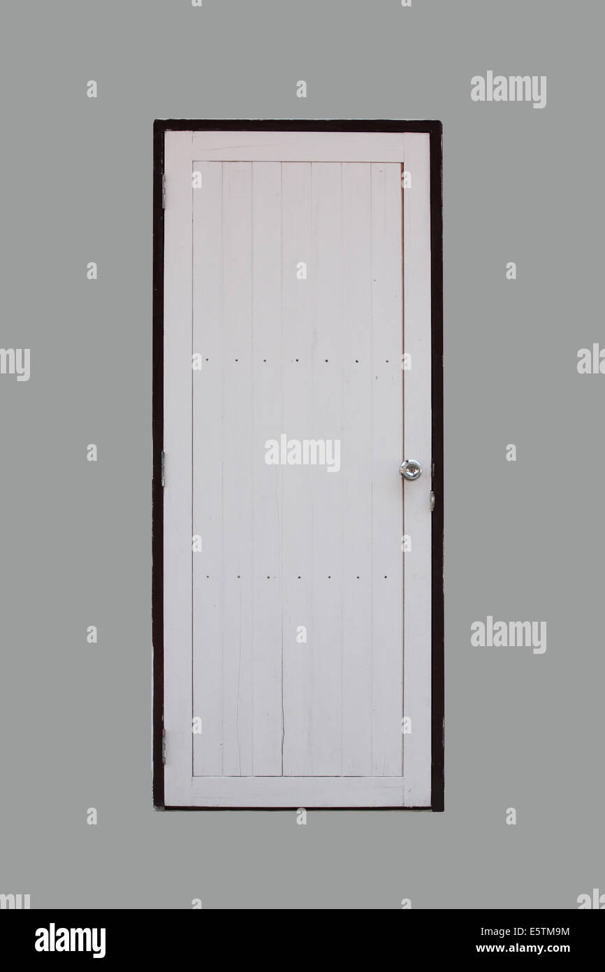 Bianco porta in legno su sfondo grigio. Foto Stock