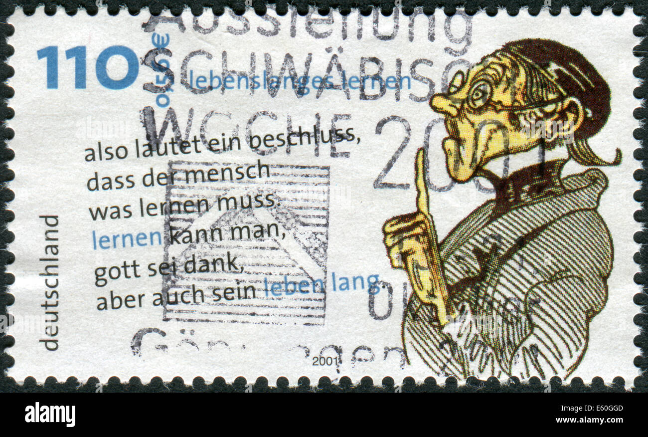 Francobollo stampato in Germania, l'Apprendimento Permanente, mostra Lehrer Laempel, disegno e citazioni di Wilhelm Busch Foto Stock