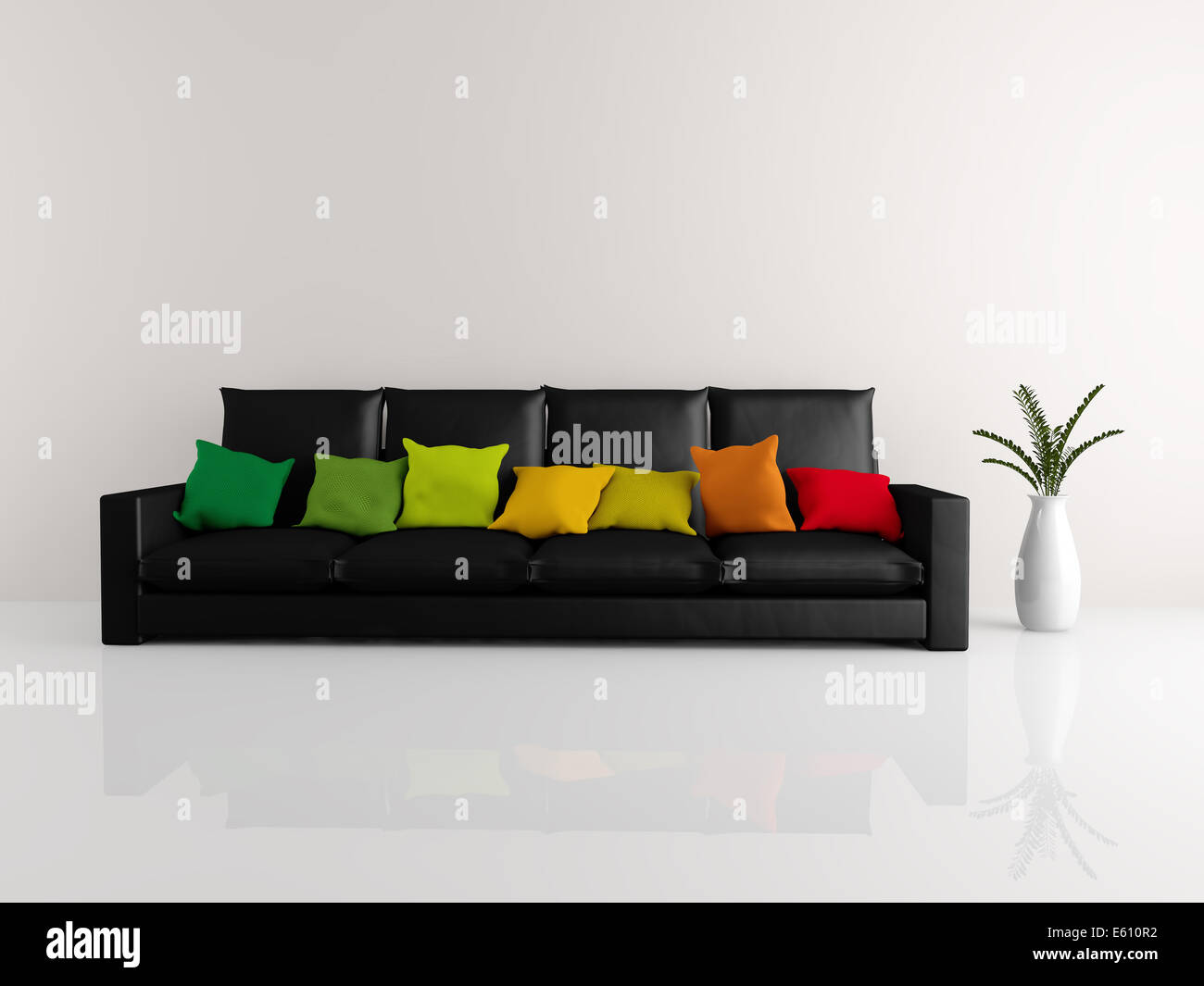 Una camera con un nero minimalista divano ricoperto di cuscini colorati e  un vaso di fiori Foto stock - Alamy