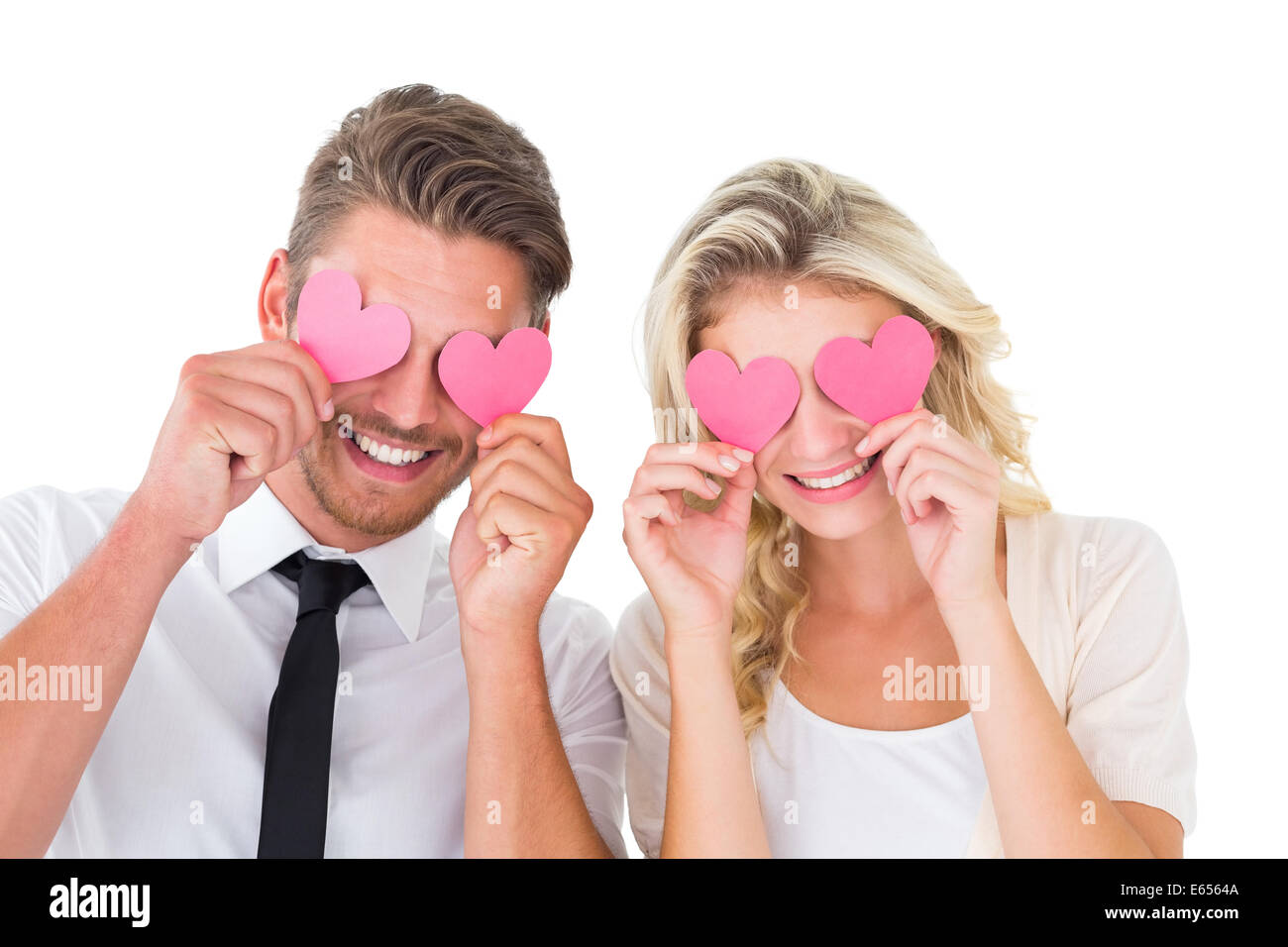 Attraente coppia giovane azienda Cuori rosa sopra gli occhi Foto Stock