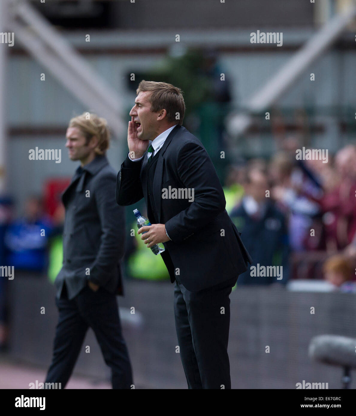 Edimburgo, Scozia. 17 Ago, 2014. Hibs Manager Alan Stubbs durante il campionato scozzese match tra i cuori e Hibs da Tynecastle Stadium. Credito: Azione Sport Plus/Alamy Live News Foto Stock