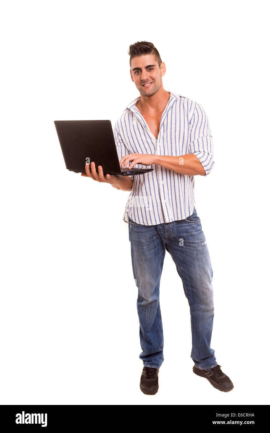 Giovane uomo bello lavorare con il computer portatile Foto Stock