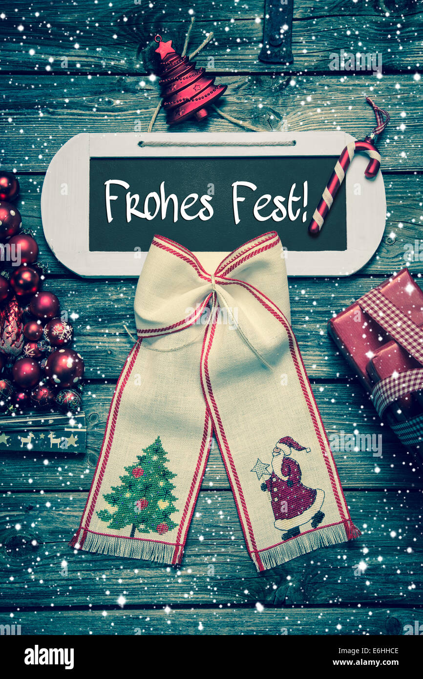 Buon Natale biglietto di auguri con il testo "Frohes Fest' in tedesco lettere - in stile country. Foto Stock