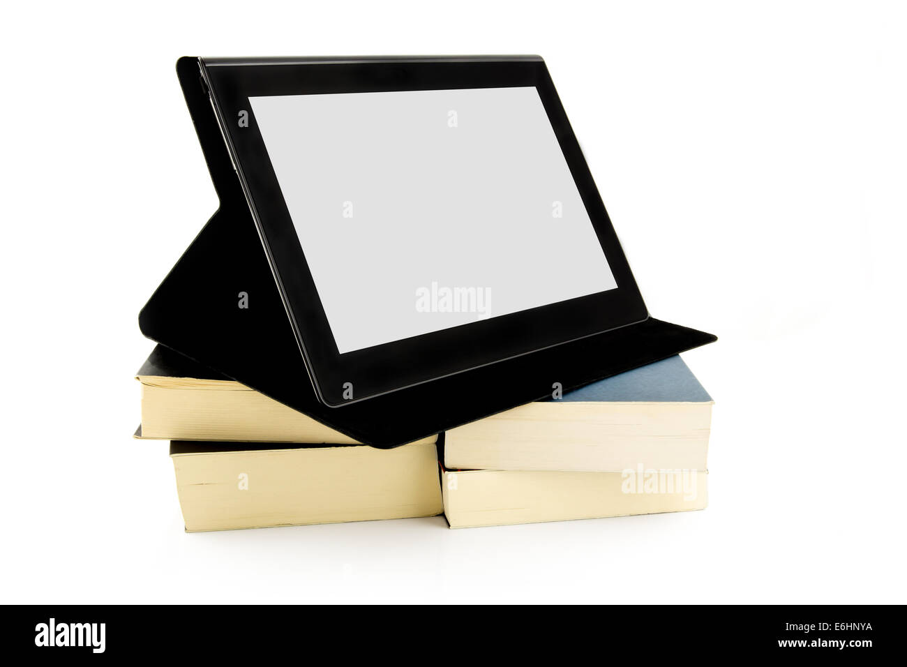 Maniera moderna del concetto di lettura. Libri e un dispositivo tablet pc. Foto Stock