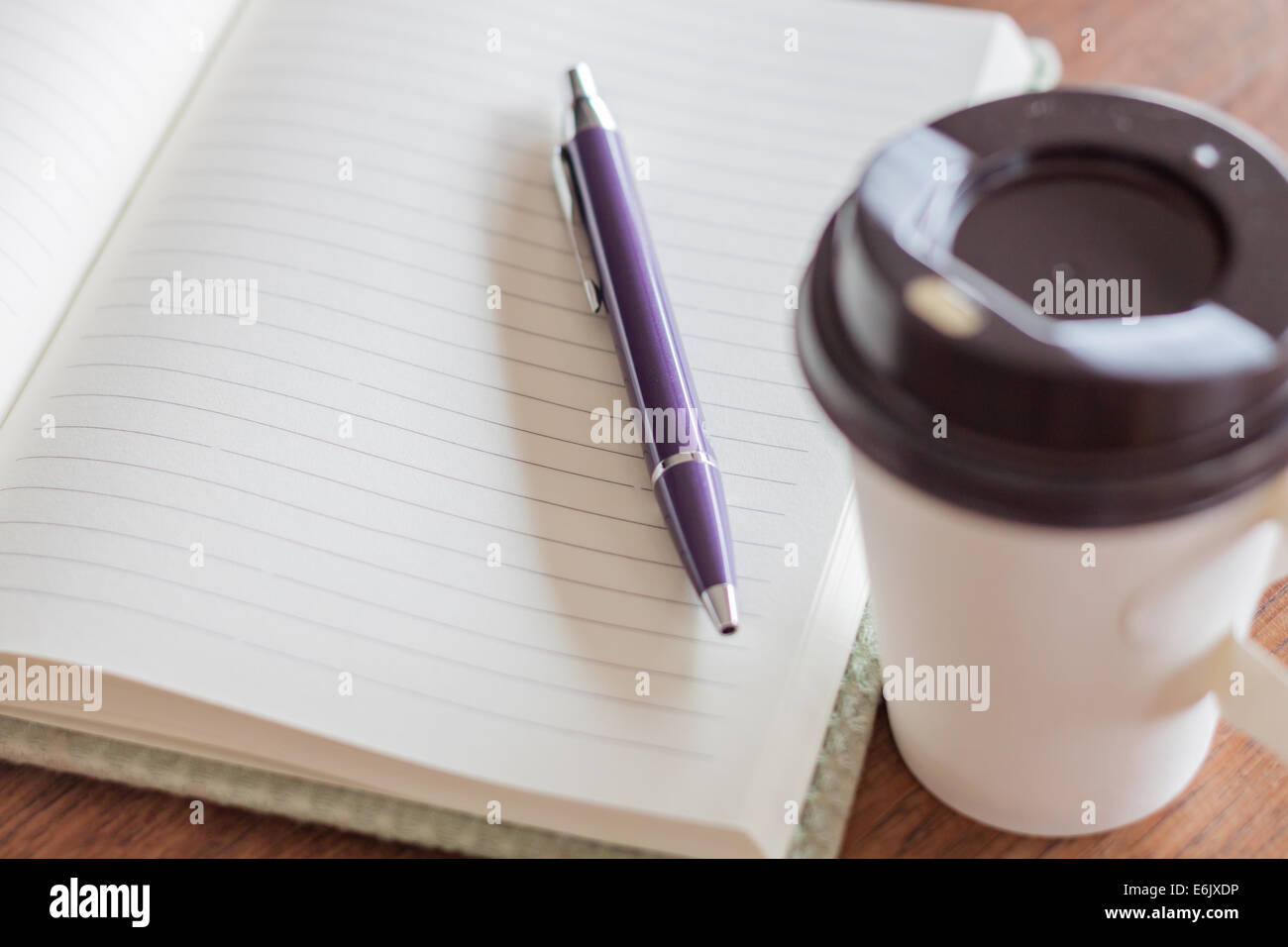 Penna e notebook con tazza di caffè, stock photo Foto Stock