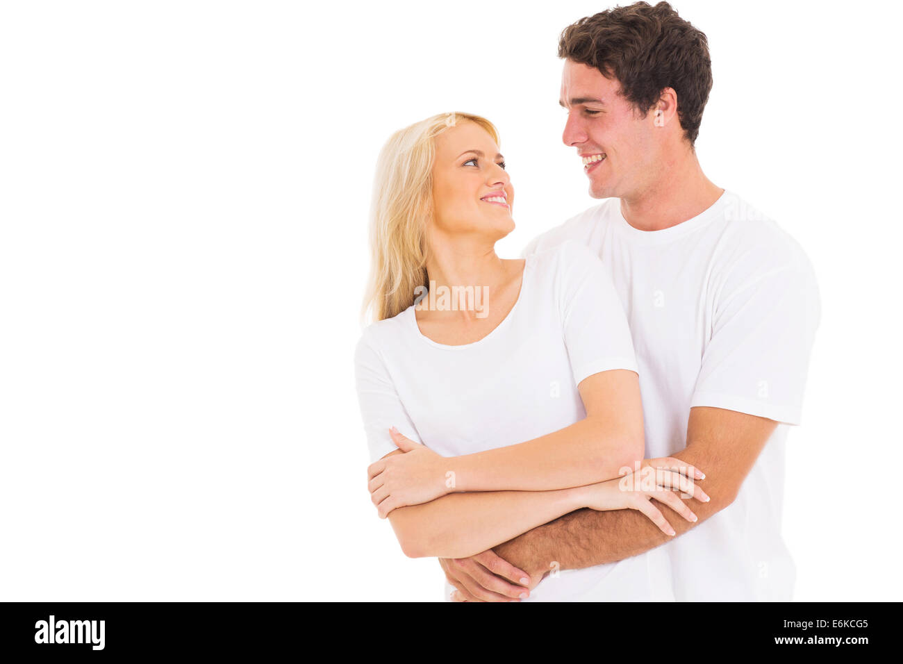 Ritratto di coppia giovane costeggiata su sfondo bianco Foto Stock