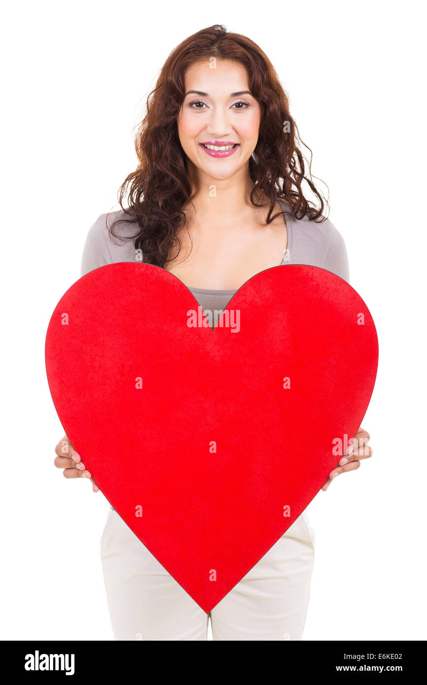 Ritratto di Pretty girl holding forma di cuore su sfondo bianco Foto Stock