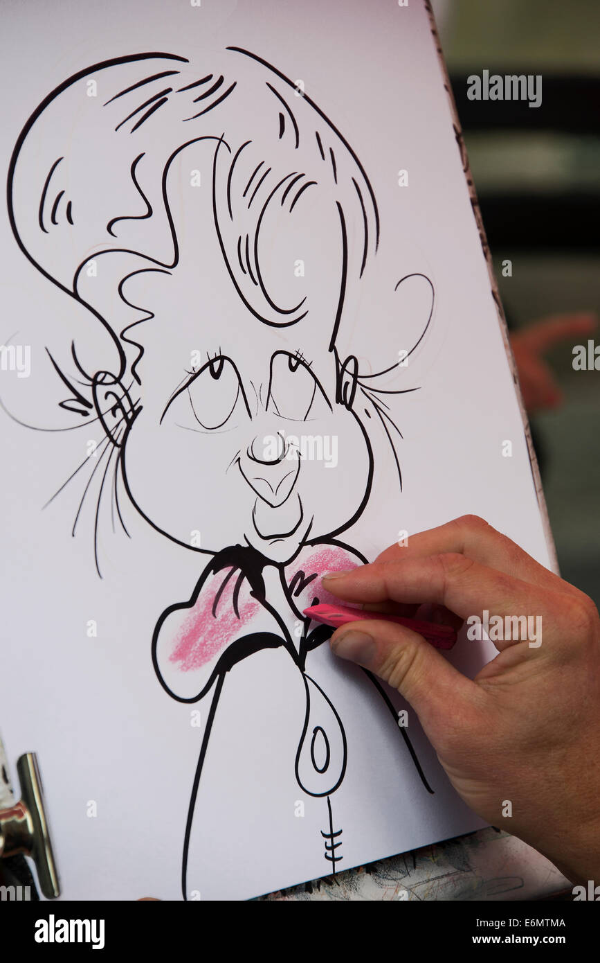 Un Artista Il Disegno Di Una Caricatura Sul Royal Mile Di Edimburgo Foto Stock Alamy