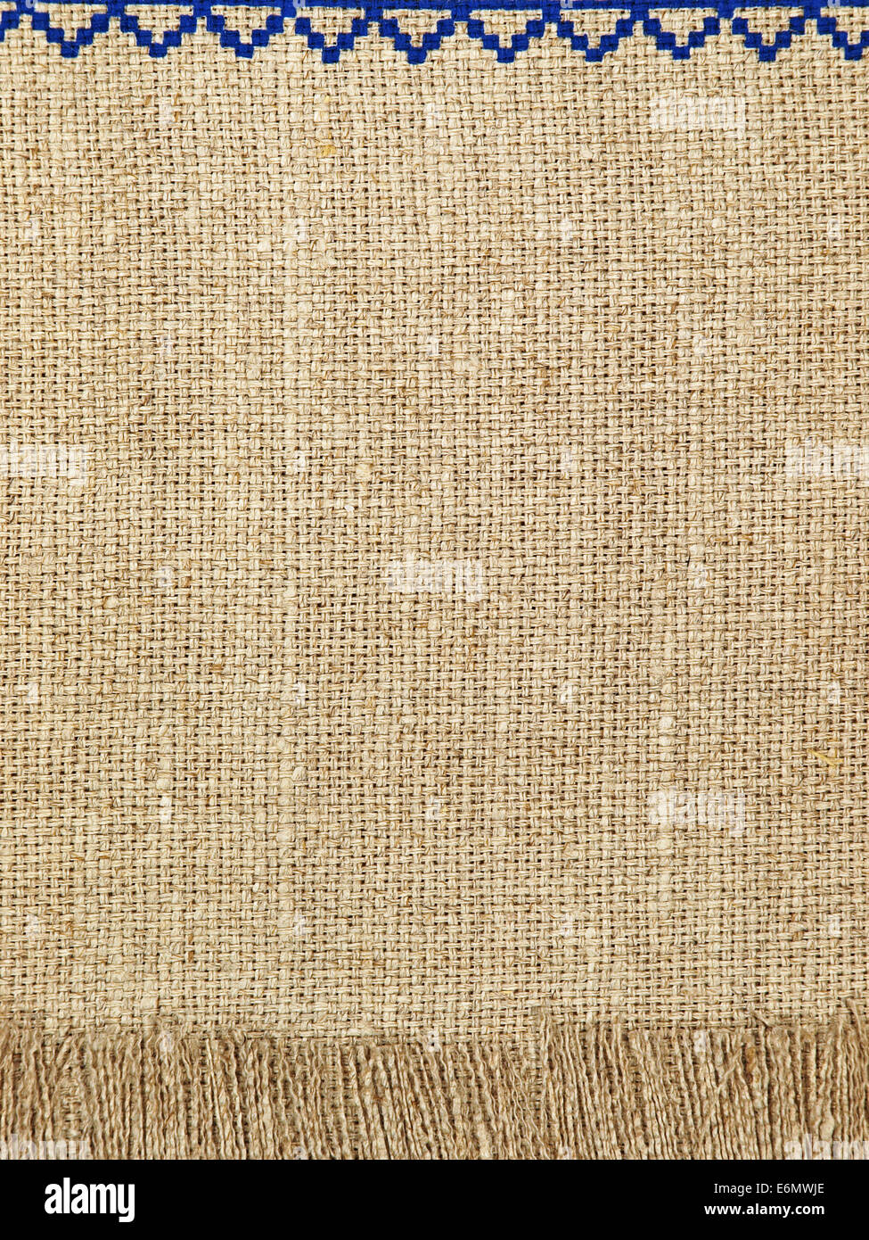 Lino naturale pattern texture con frangia come sfondo. Foto Stock