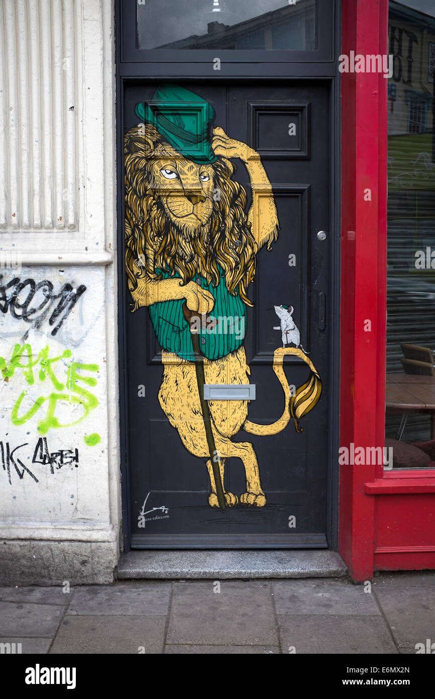 Arte di strada o urbane graffitti di Stokes Croft Bristol Foto Stock