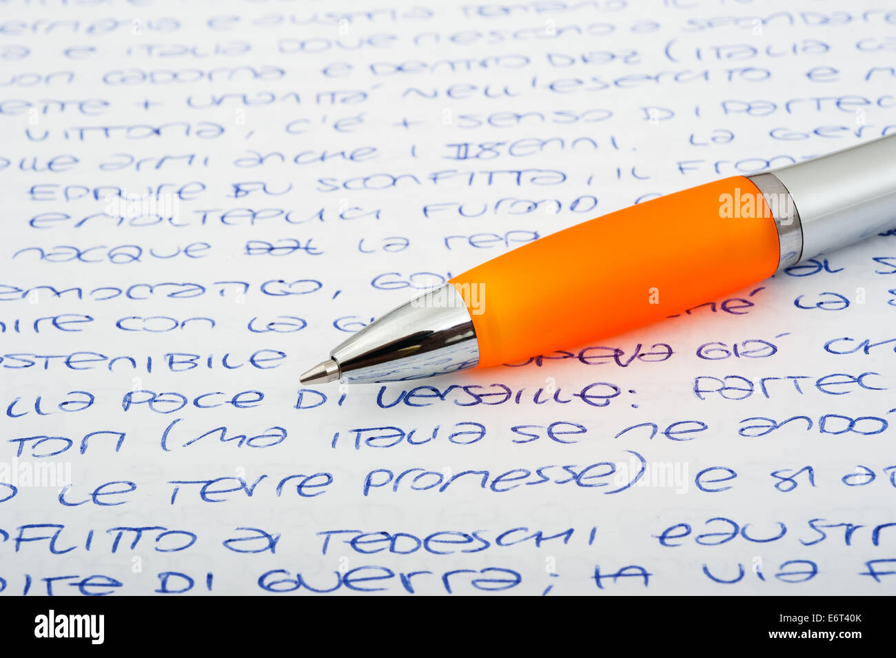 Orange ballpen on a letters background Foto Stock