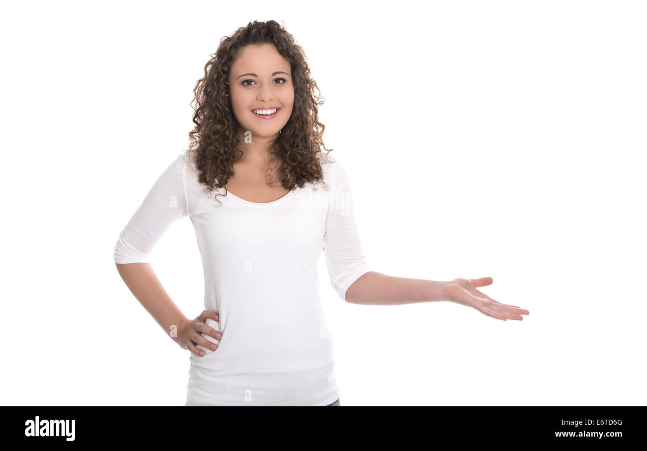 Ragazza adolescente presentando con la mano su sfondo bianco. Foto Stock