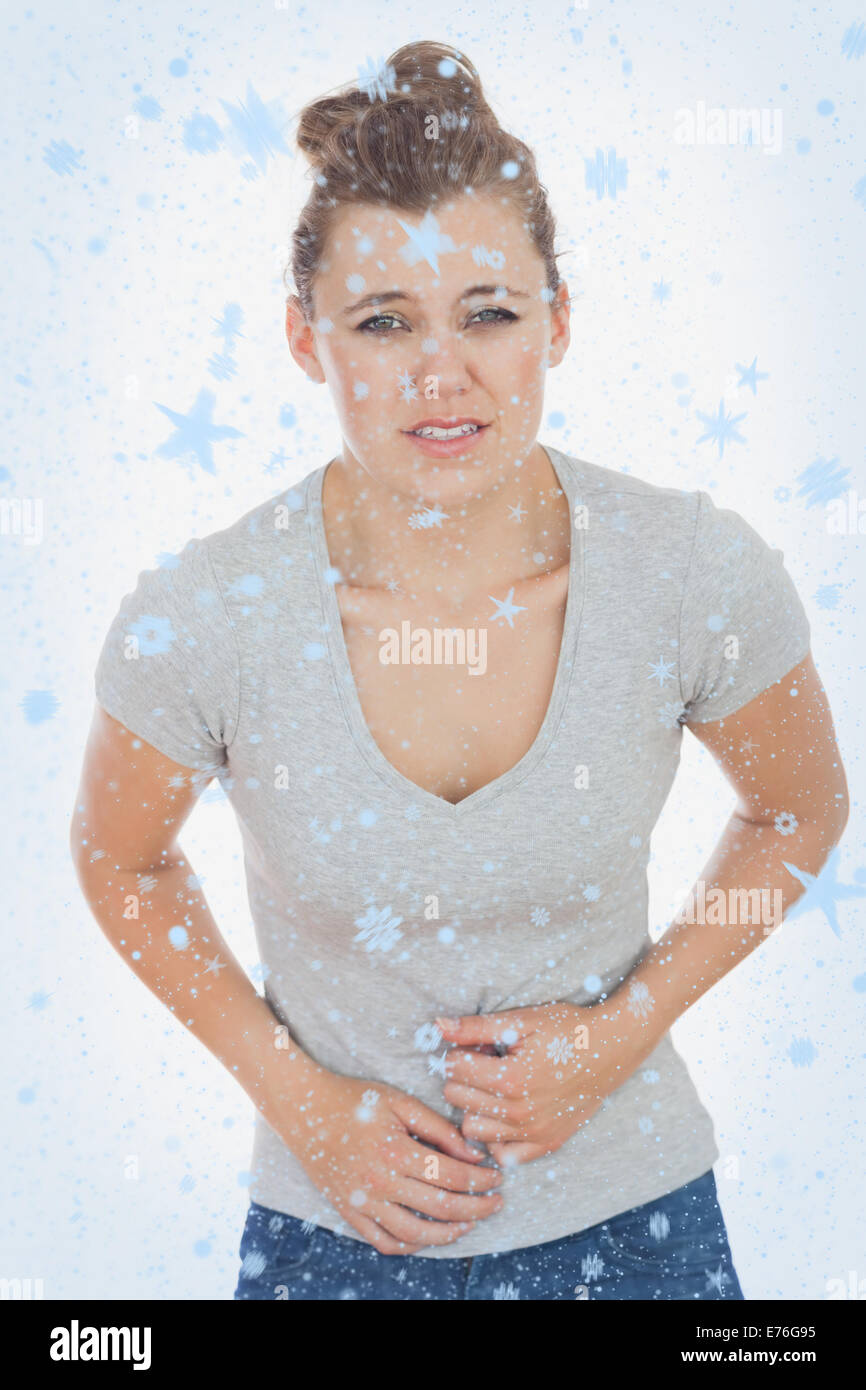 Immagine composita della donna che soffre di dolori di stomaco Foto Stock
