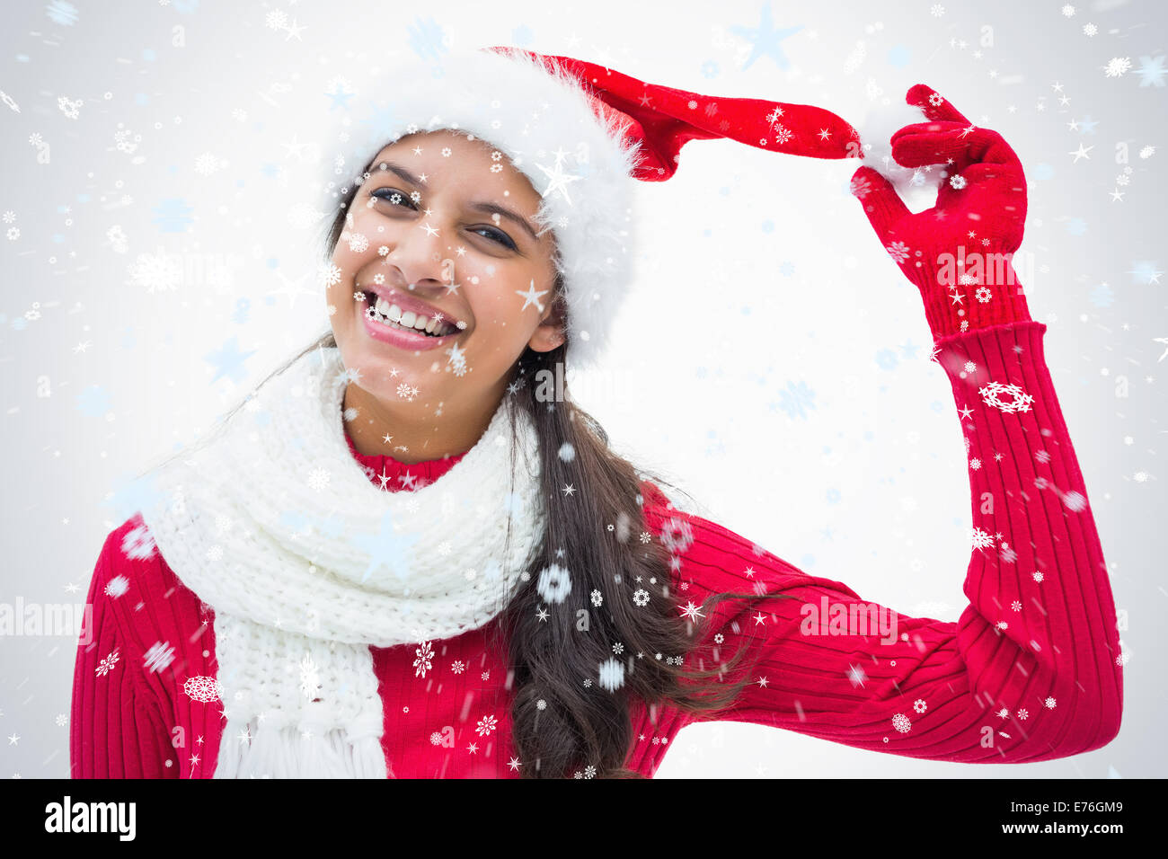 Immagine composita di festosa bella donna sorridente in telecamera Foto Stock
