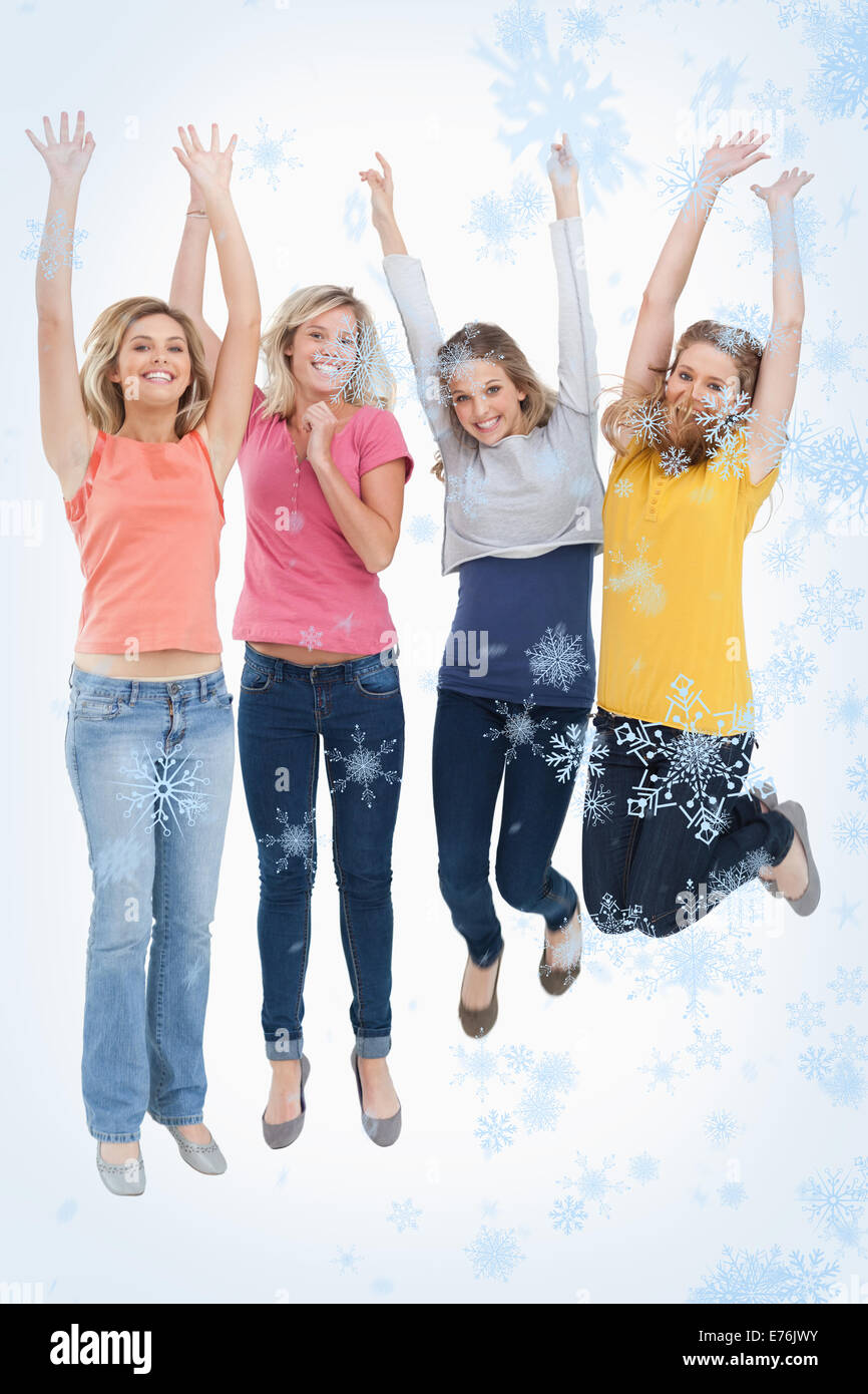 Immagine composita di sorridere celebrando le ragazze del salto in alto Foto Stock