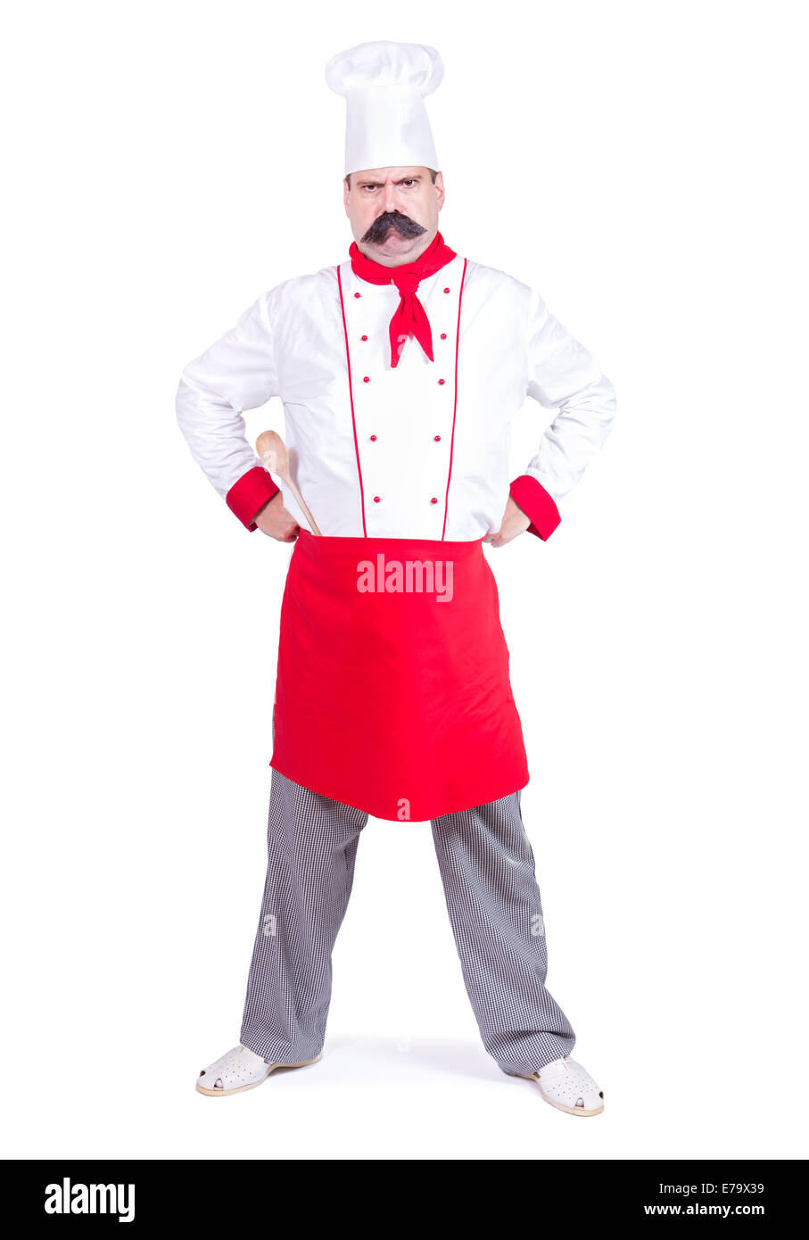 Nuvoloso chef in piedi con le mani sui fianchi Foto Stock