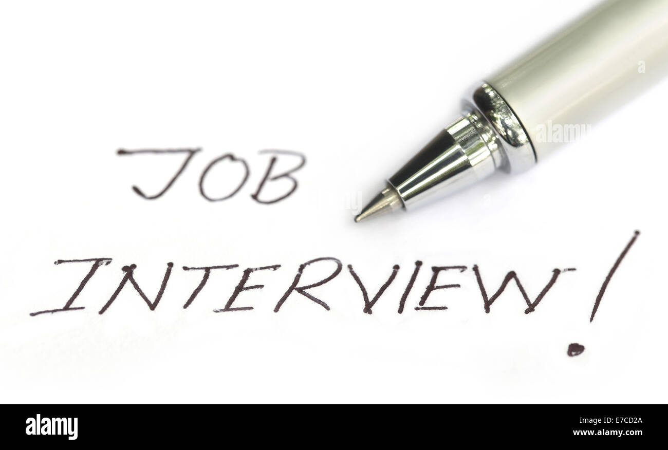 Job Interview written on a white paper with pen Foto Stock