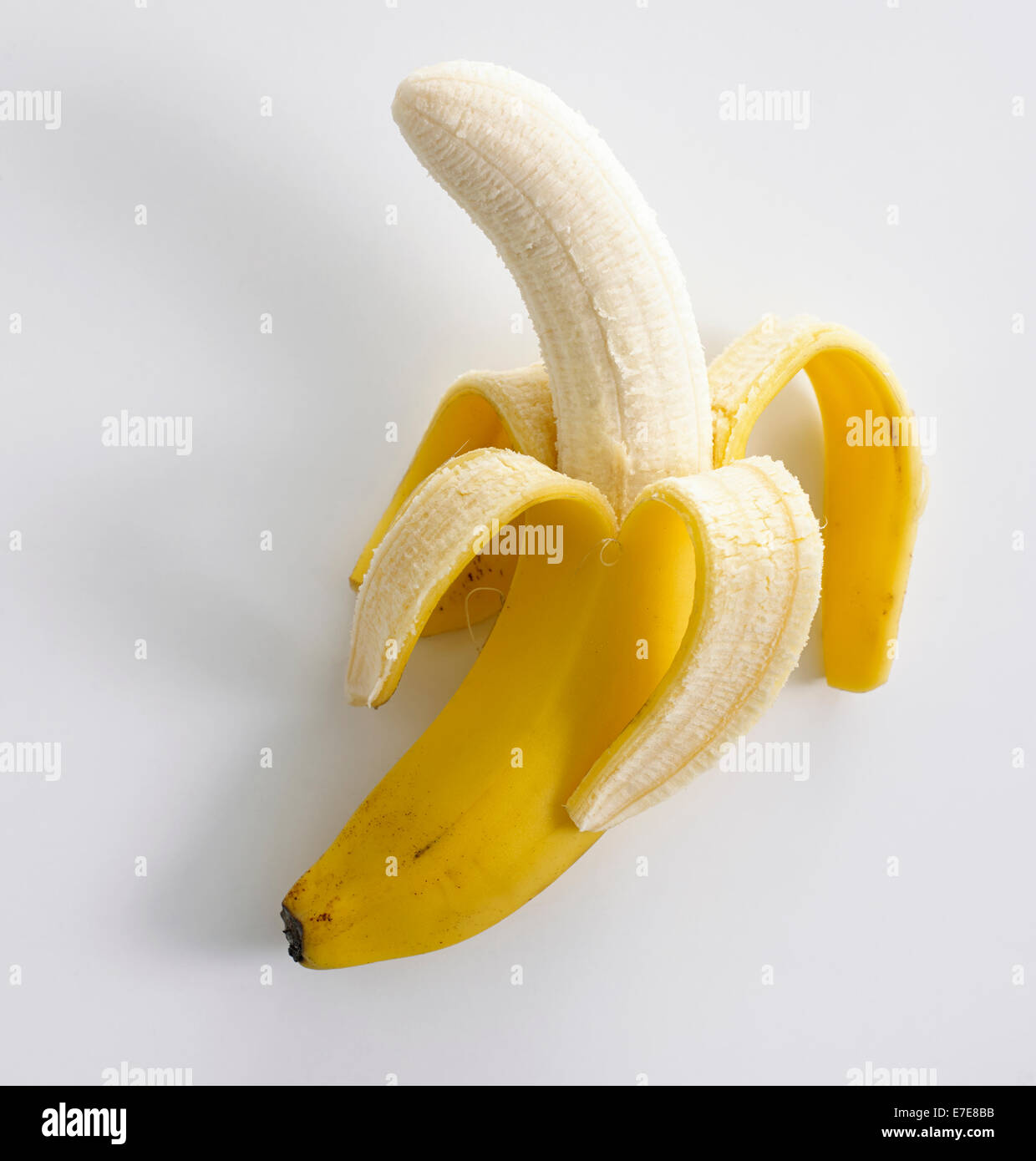 Banana sbucciata Foto Stock