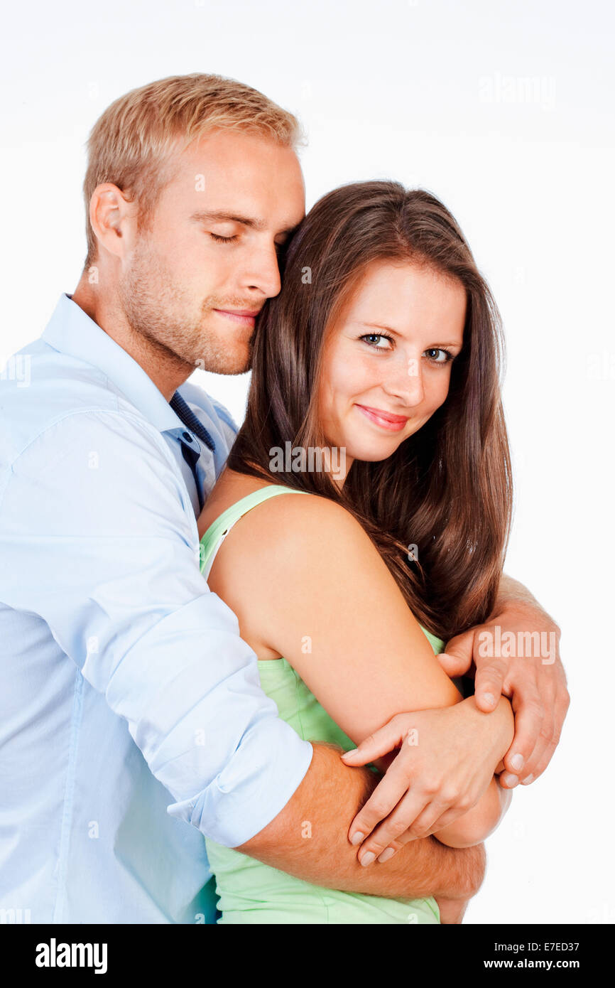 Ritratto di una felice coppia giovane sorridente cercando - Isolato su bianco Foto Stock