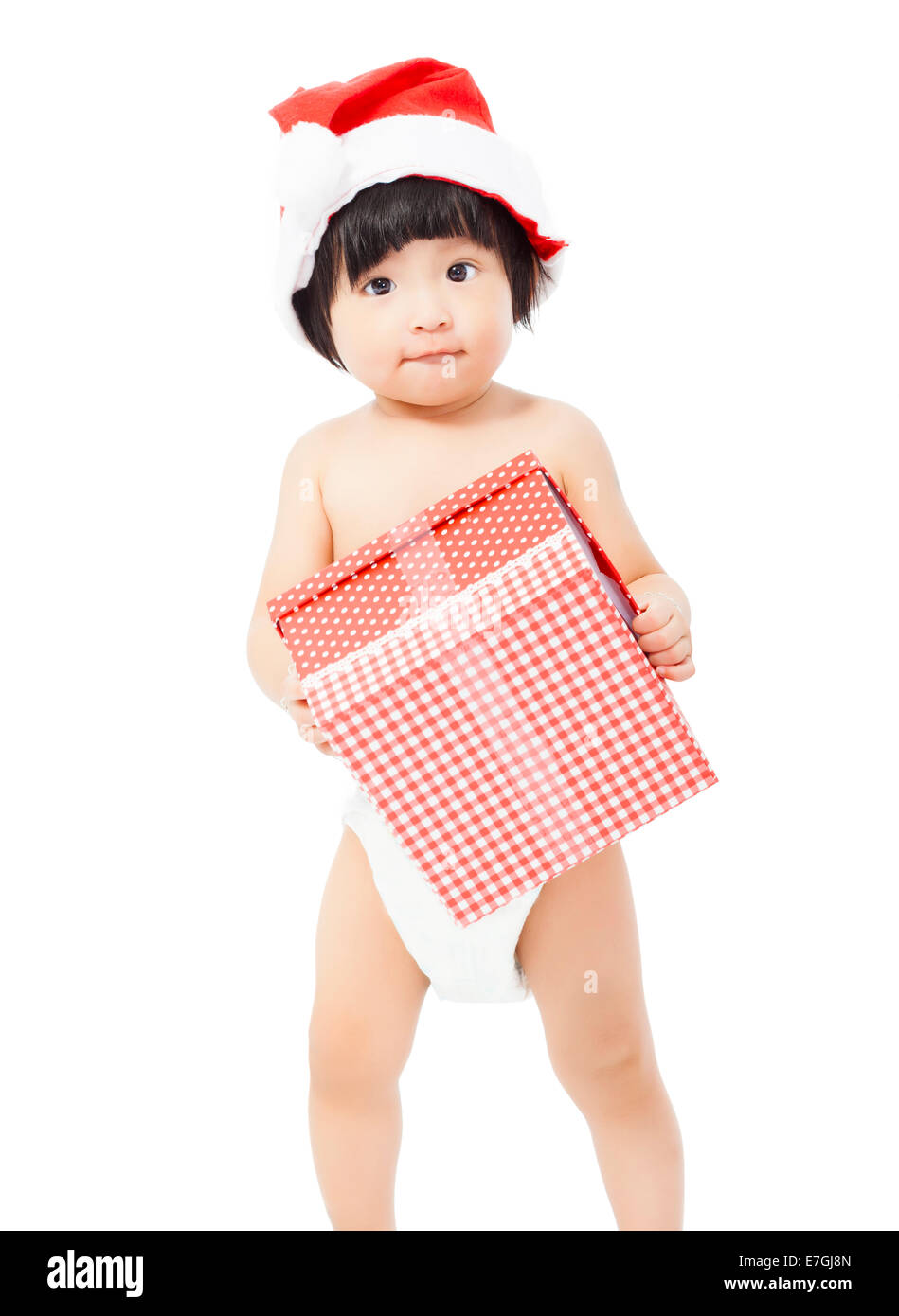 Carino baby in Santa pac tenendo un regalo su sfondo bianco Foto Stock
