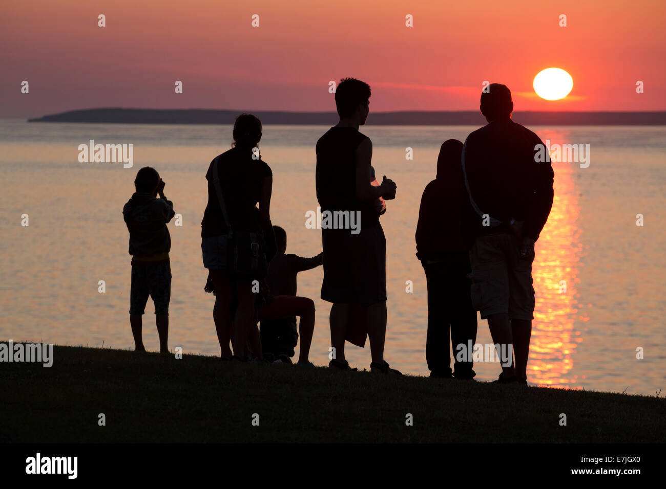 Persone nella luce del tramonto, John O'Semole, Scozia Foto Stock