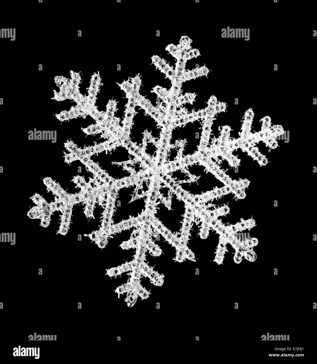 Il simbolo del fiocco di neve con uno sfondo nero Foto Stock