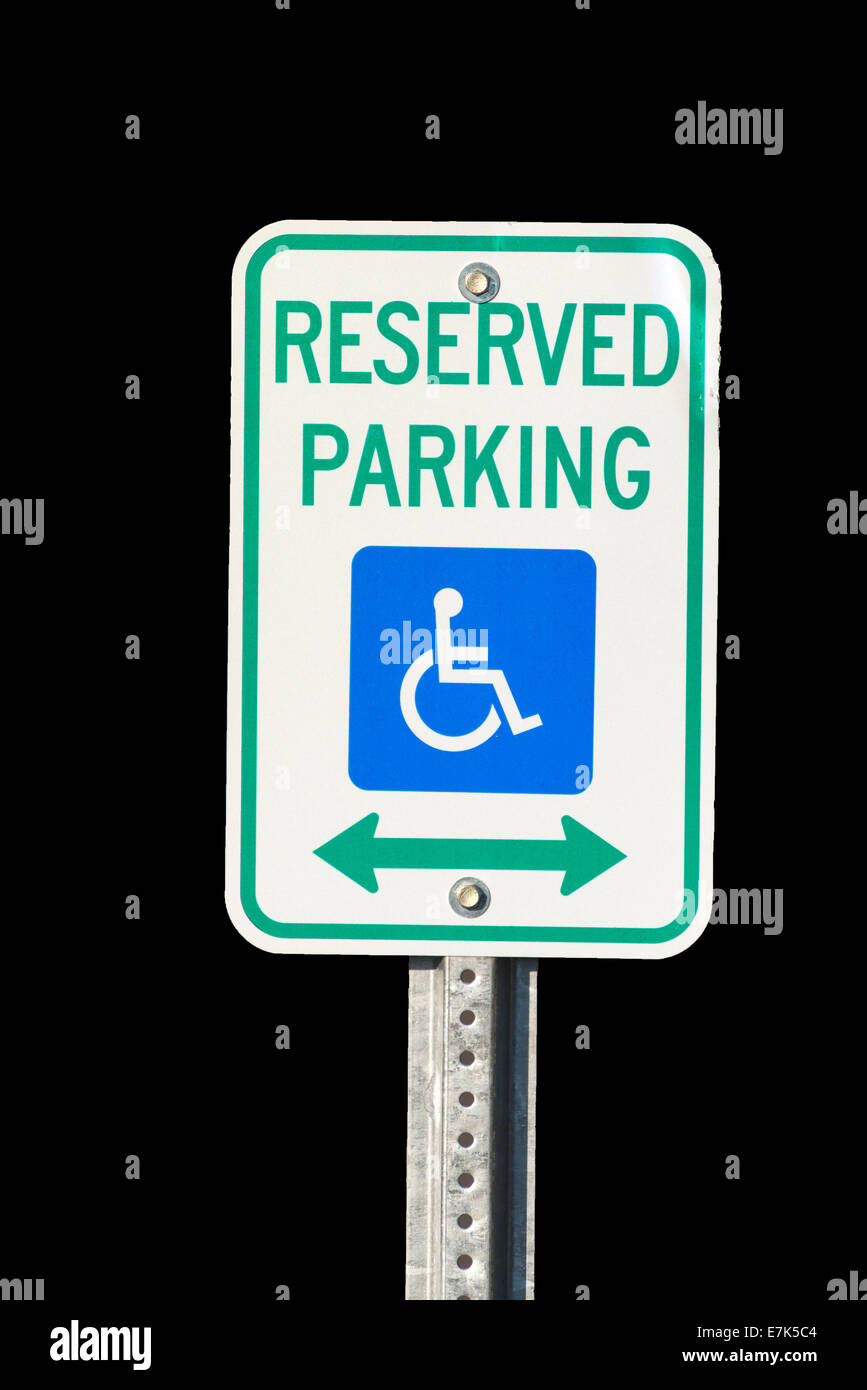 Parcheggio riservato per portatori di handicap di segno. Foto Stock