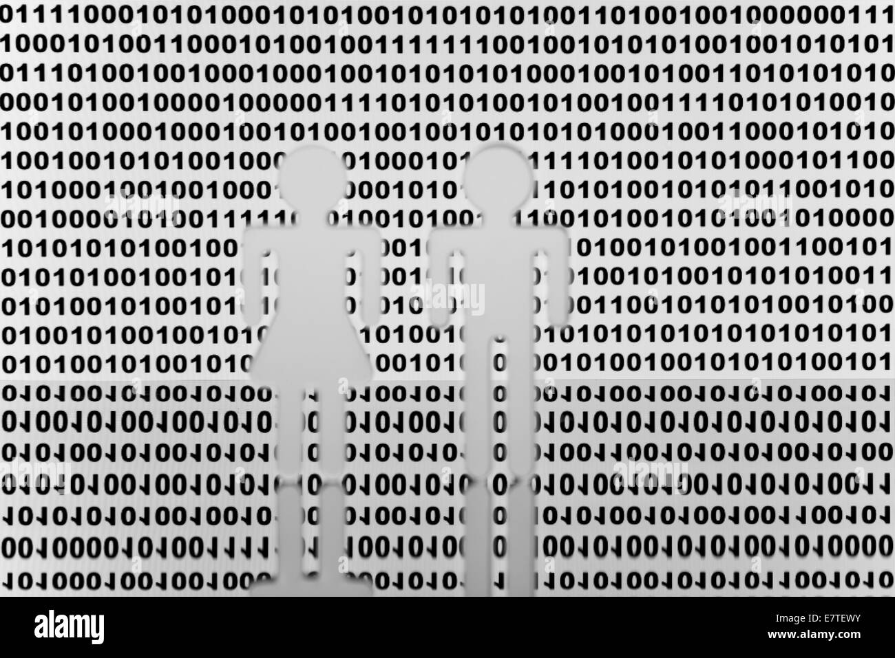 Due figure nella parte anteriore del codice binario Foto Stock