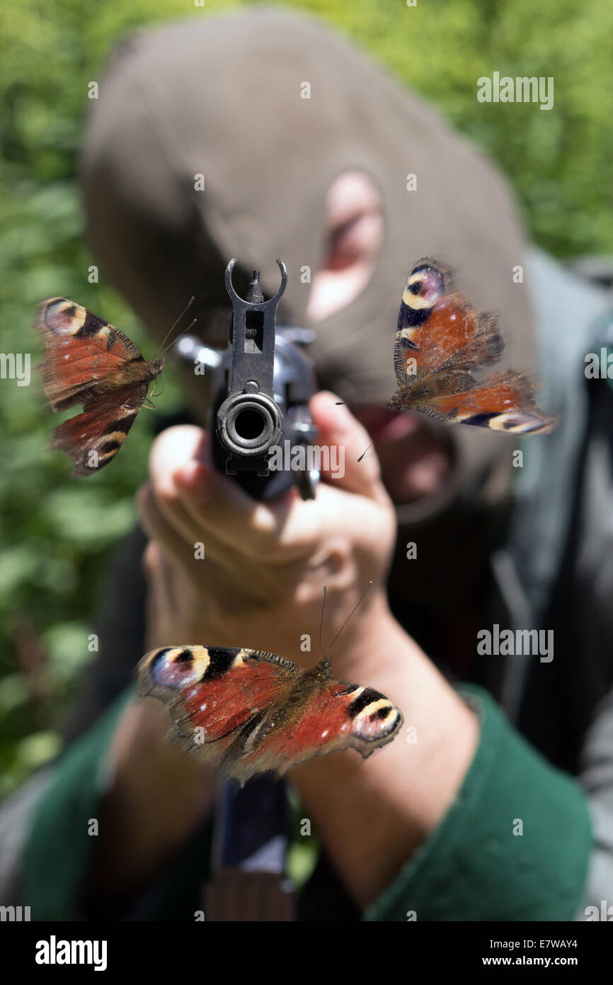 Soldato con passamontagna dispositivo di puntamento con macchina automatica Foto Stock