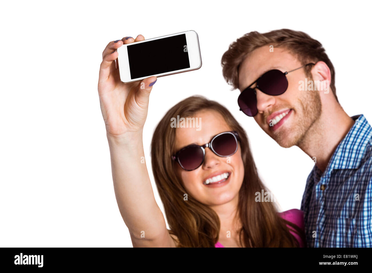 Giovane tenendo selfie con smart phone Foto Stock