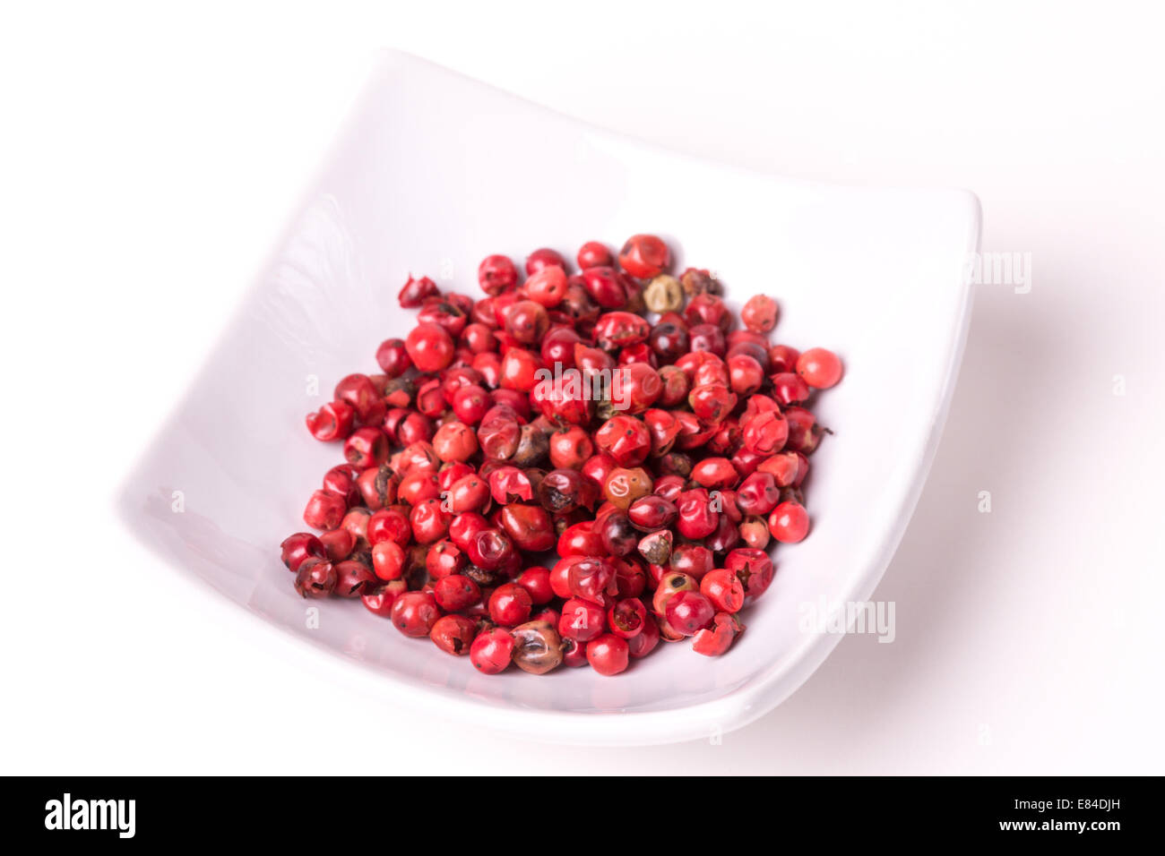 Peppe rosa su sfondo bianco, studio isolato Foto Stock