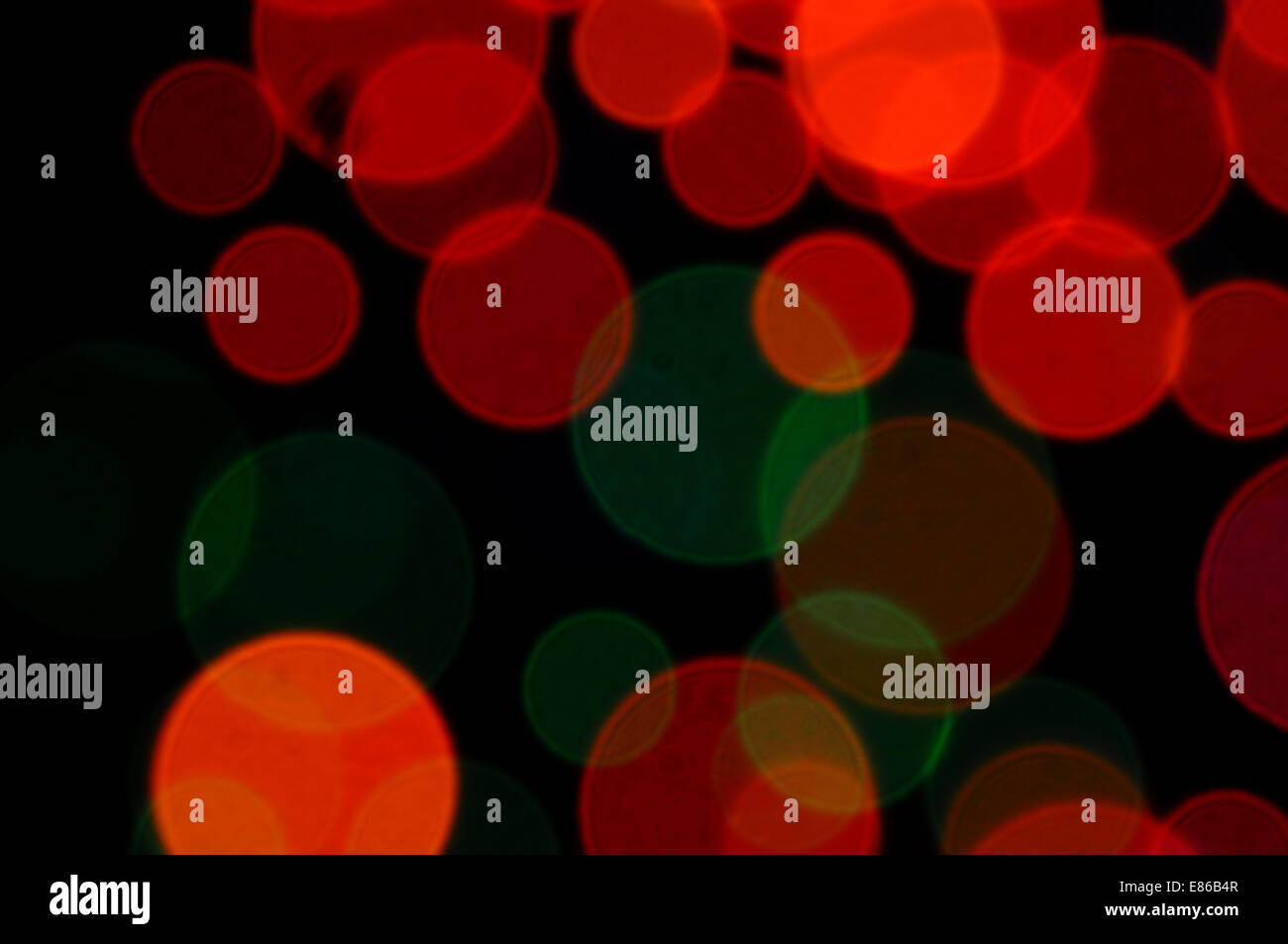 Abstract cerchi colorati di pattern sfocata luci di notte. Foto Stock