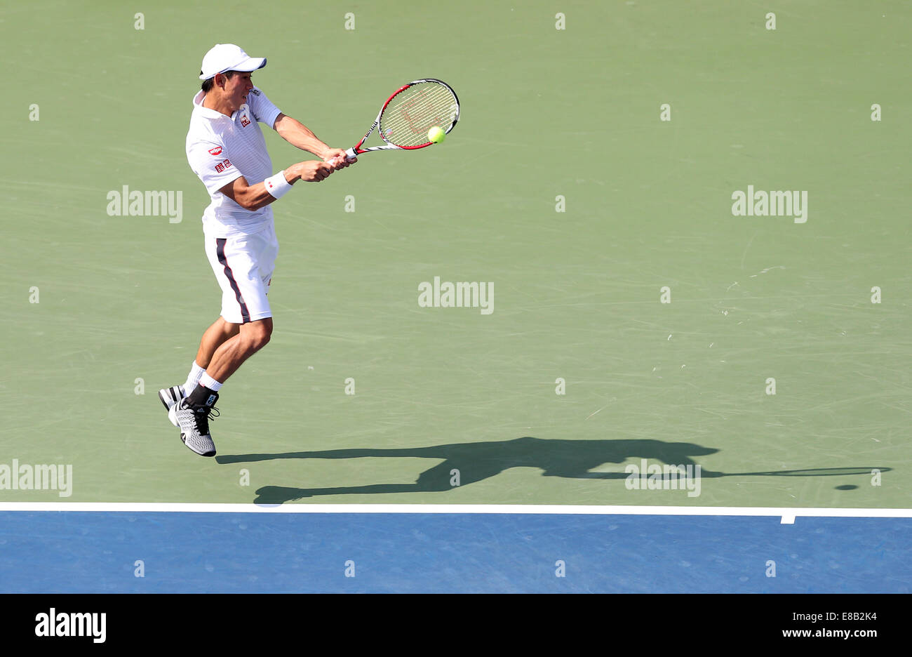 Kei Nishikori (JPN) in azione a US Open 2014 in New York, Stati Uniti d'America. Foto Stock