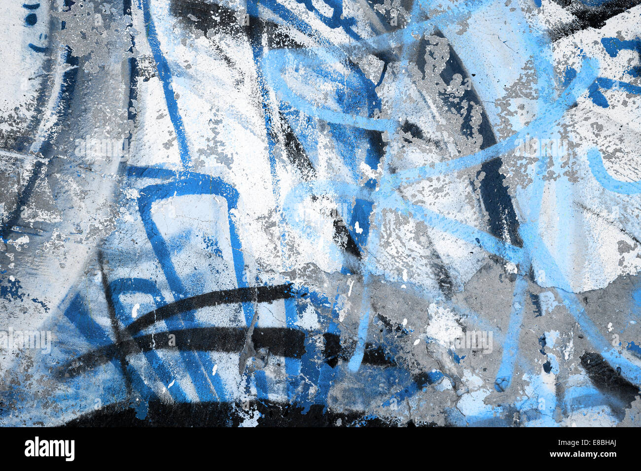 Abstract blu frammento graffiti su grigio urbano parete di calcestruzzo Foto Stock